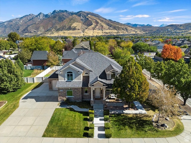birds eye view of property with a mountain view