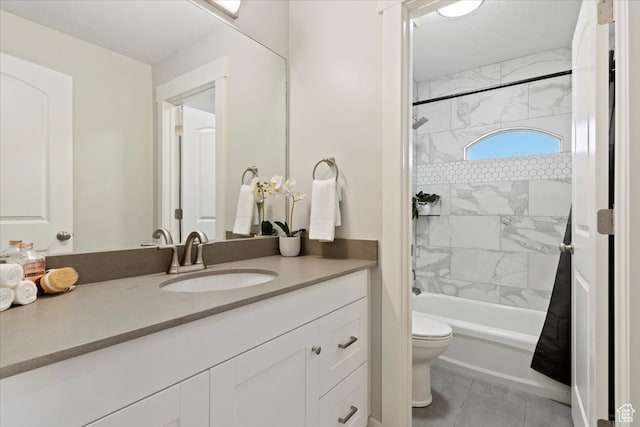 full bathroom featuring vanity, toilet, tile patterned floors, and tiled shower / bath combo
