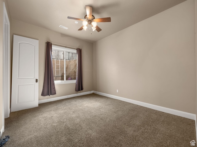 unfurnished room with ceiling fan and carpet flooring