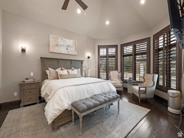 bedroom featuring ceiling fan, dark hardwood / wood-style floors, and high vaulted ceiling