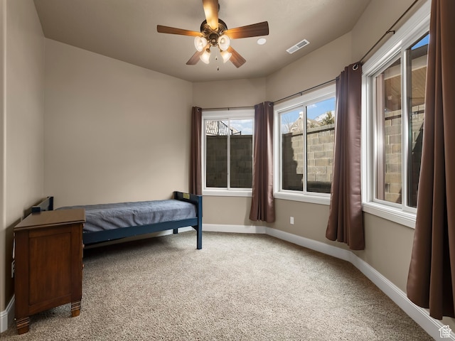 bedroom with ceiling fan and carpet