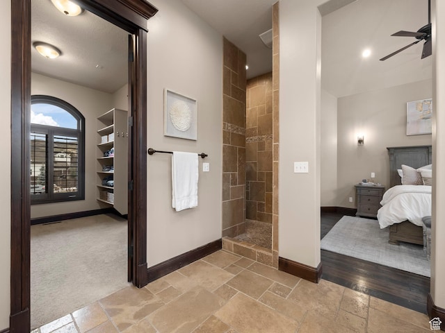 1212 N Heritage Cir, Alpine, UT 84004 - ensuite bathroom with stone tile flooring, walk in shower, and a ceiling fan