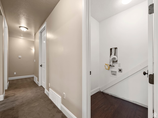 hallway featuring a textured ceiling