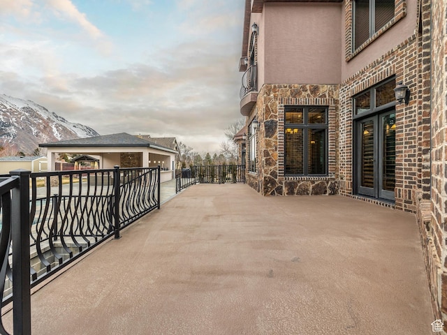 view of patio / terrace featuring a mountain view