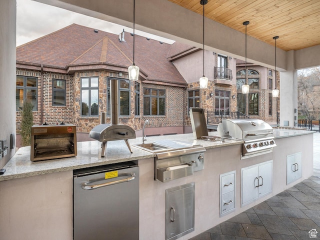 view of patio / terrace featuring an outdoor kitchen and a grill