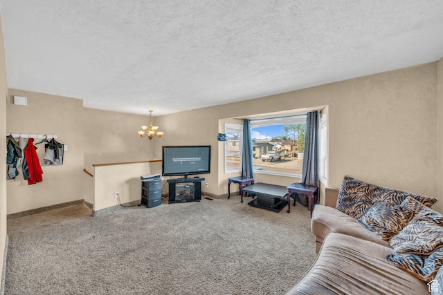 carpeted living room featuring a notable chandelier and a textured ceiling