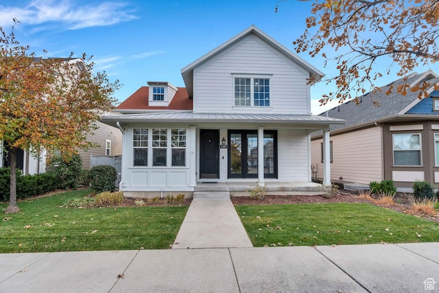 4489 W Milford Dr, South Jordan, UT 84009 - view of front of house featuring covered porch, a standing seam roof, metal roof, and a front yard