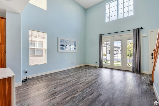 4489 W Milford Dr, South Jordan, UT 84009 - interior space featuring baseboards, a high ceiling, and wood finished floors