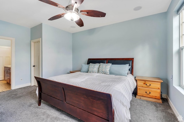 4489 W Milford Dr, South Jordan, UT 84009 - bedroom with baseboards, a ceiling fan, connected bathroom, and light carpet