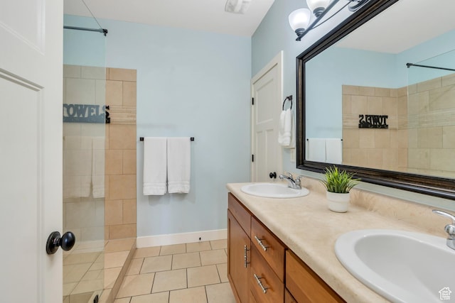 4489 W Milford Dr, South Jordan, UT 84009 - bathroom featuring a sink, tile patterned flooring, a tile shower, and double vanity