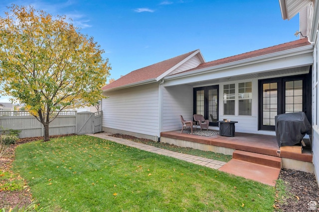 4489 W Milford Dr, South Jordan, UT 84009 - rear view of house with fence, a gate, a shingled roof, and a yard