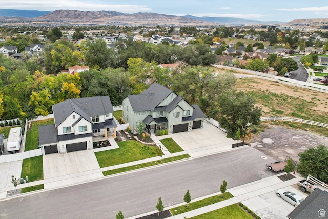 drone / aerial view with a mountain view and a residential view