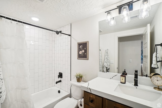 full bath featuring toilet, vanity, a textured ceiling, and shower / bath combo with shower curtain