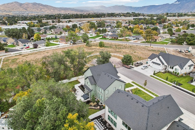 birds eye view of property featuring a mountain view and a residential view