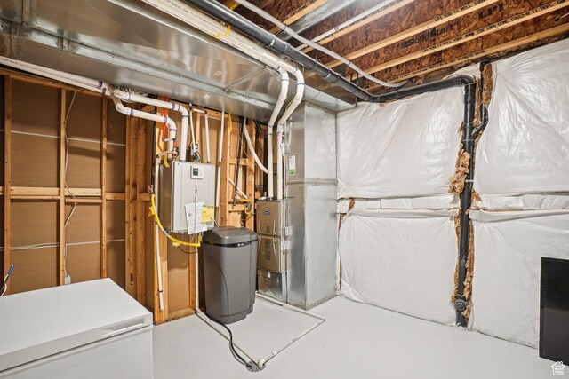 unfinished below grade area with refrigerator