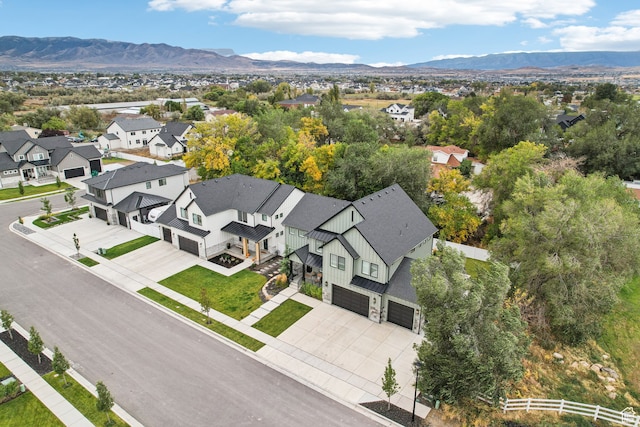 birds eye view of property with a residential view and a mountain view