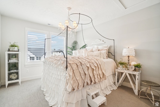 bedroom featuring carpet floors, baseboards, a notable chandelier, and visible vents