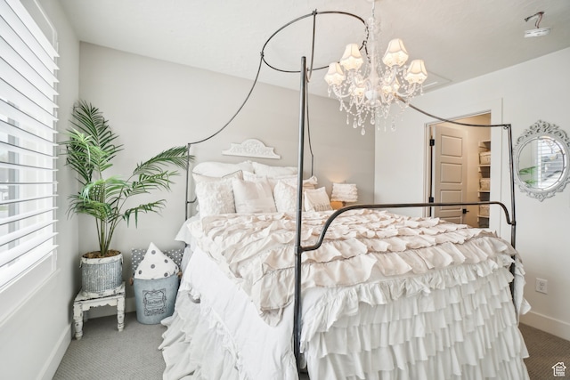 carpeted bedroom with a notable chandelier and baseboards