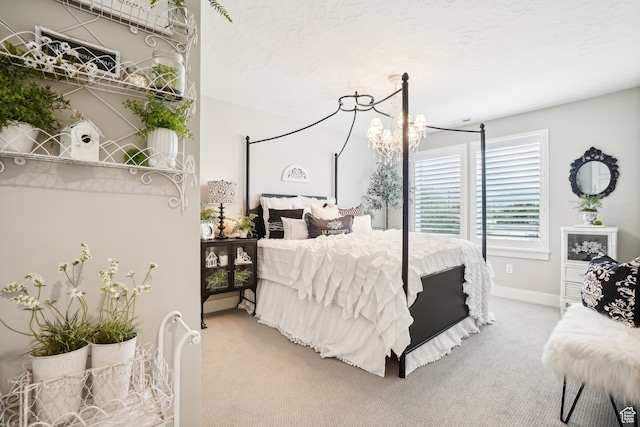 carpeted bedroom with baseboards
