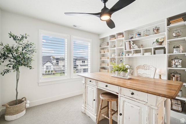 office with baseboards, ceiling fan, light carpet, and visible vents