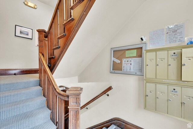 276 E Broadway St S Unit 3, Salt Lake City, UT 84111 - stairs featuring mail area, carpet flooring, and lofted ceiling
