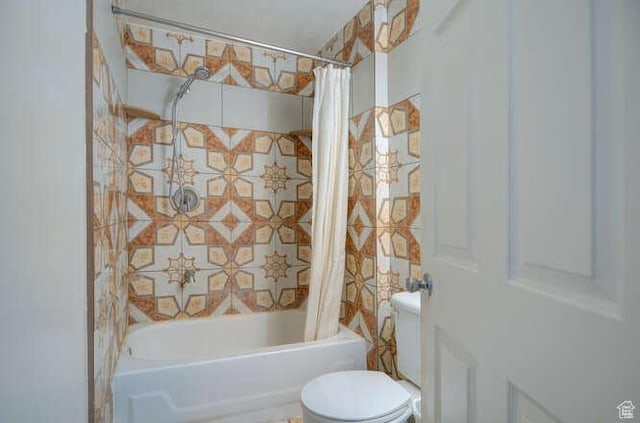 full bath featuring toilet and shower / bath combo with shower curtain