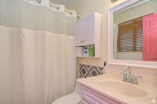bathroom featuring vanity and a shower with curtain