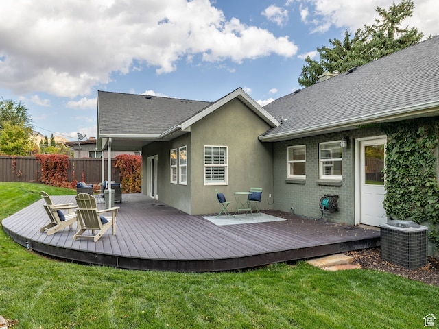 1975 E Gunderson Ln S, Holladay, UT 84124 - rear view of house with central air condition unit, a deck, and a lawn