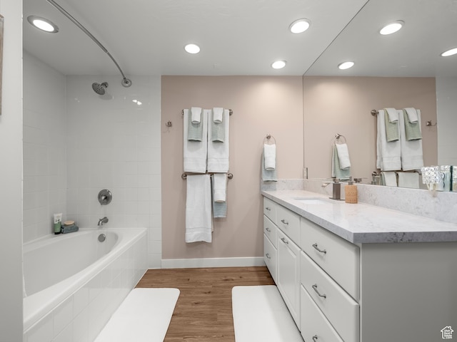 1975 E Gunderson Ln S, Holladay, UT 84124 - bathroom featuring vanity, tiled shower / bath, and hardwood / wood-style flooring
