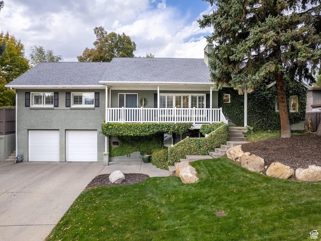 view of front facade with a garage and a front lawn
