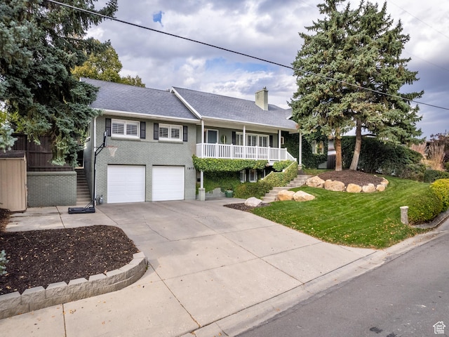 1975 E Gunderson Ln S, Holladay, UT 84124 - view of front of home with a garage and a porch