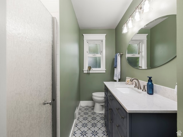 1975 E Gunderson Ln S, Holladay, UT 84124 - bathroom featuring a shower with door, vanity, toilet, and tile patterned flooring