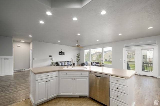 kitchen with visible vents, a sink, stainless steel dishwasher, open floor plan, and recessed lighting
