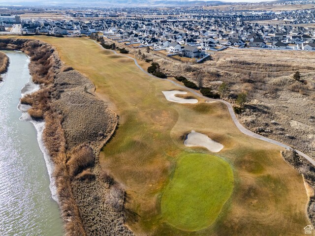birds eye view of property featuring a residential view and a water view