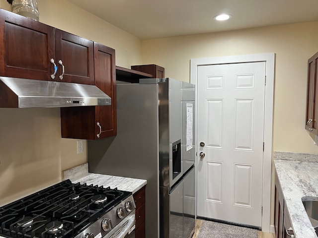 415 N 1st St W, Downey, ID 83234 - kitchen with light stone countertops and stainless steel range
