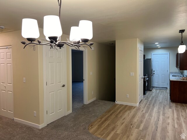 415 N 1st St W, Downey, ID 83234 - unfurnished dining area with a chandelier and light wood-type flooring