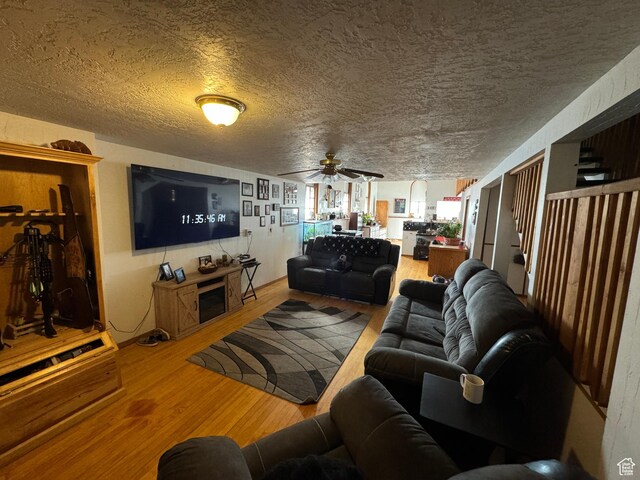 50 W 100 N, Salina, UT 84654 - living room featuring wood finished floors, ceiling fan, and a textured ceiling