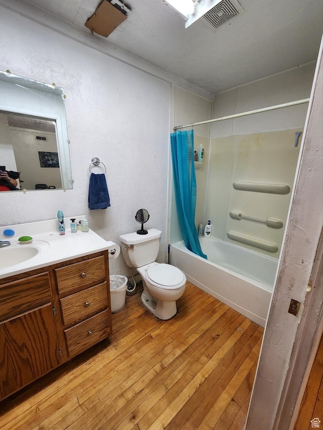 50 W 100 N, Salina, UT 84654 - bathroom featuring vanity, shower / bathtub combination with curtain, and hardwood / wood-style flooring
