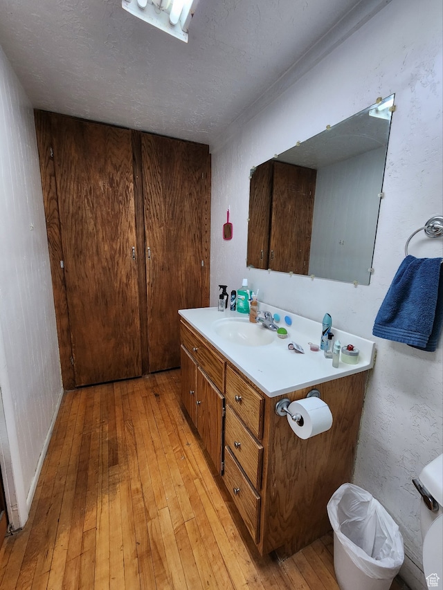 50 W 100 N, Salina, UT 84654 - bathroom with hardwood / wood-style floors, vanity, and a textured ceiling