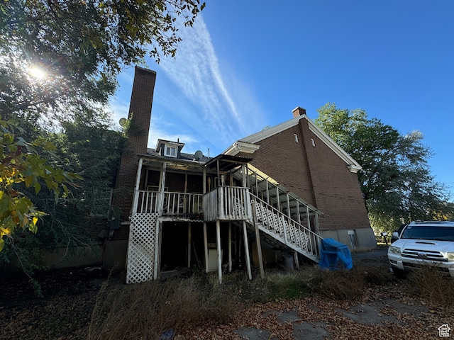 50 W 100 N, Salina, UT 84654 - back of house featuring stairway, a chimney, and a sunroom