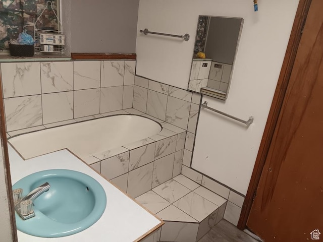 50 W 100 N, Salina, UT 84654 - bathroom featuring a relaxing tiled tub, vanity, and marble look tile flooring