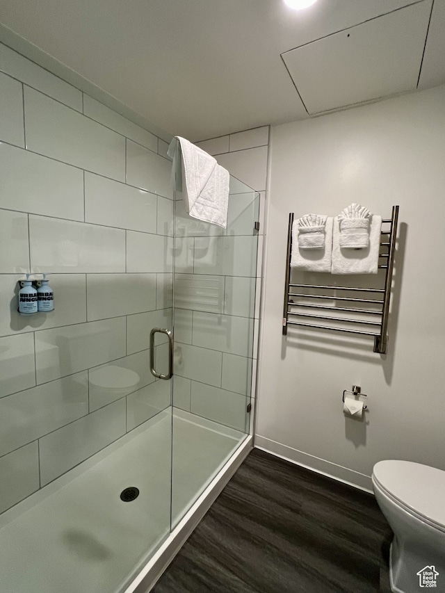 2670 Canyons Resort Dr Unit 218, Park City, UT 84098 - bathroom with toilet, wood-type flooring, radiator heating unit, and an enclosed shower