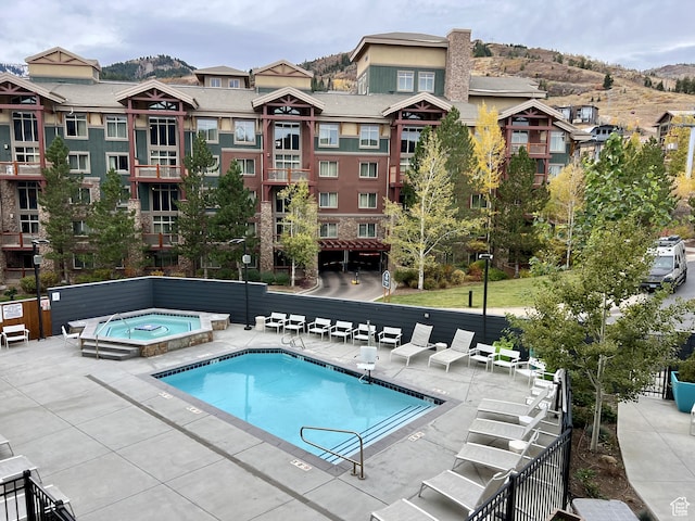 2670 Canyons Resort Dr Unit 218, Park City, UT 84098 - view of pool with a patio, a hot tub, and a mountain view