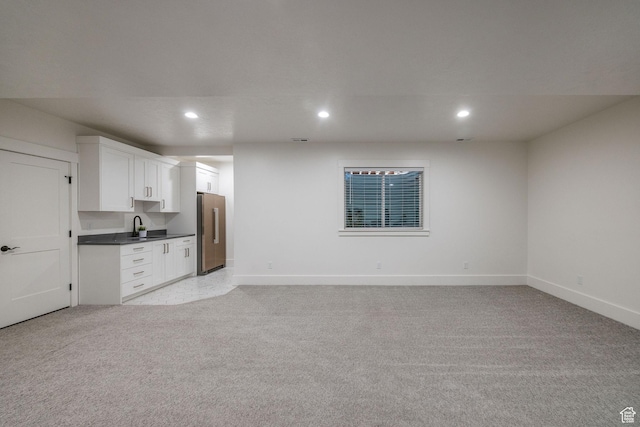 104 S 950 E, Hyde Park, UT 84318 - kitchen featuring freestanding refrigerator, a sink, recessed lighting, baseboards, and dark countertops