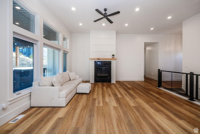 104 S 950 E, Hyde Park, UT 84318 - living area with ceiling fan, light wood finished floors, a fireplace, recessed lighting, and baseboards