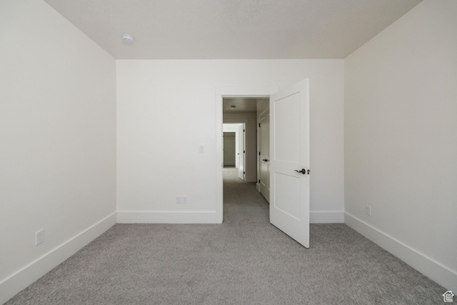 104 S 950 E, Hyde Park, UT 84318 - empty room featuring carpet, baseboards, and a smoke detector