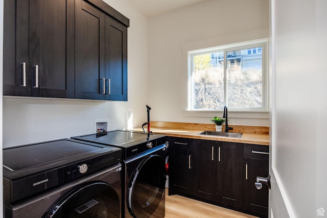 104 S 950 E, Hyde Park, UT 84318 - laundry area featuring cabinet space, separate washer and dryer, and light wood-style flooring