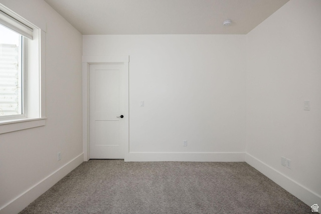 104 S 950 E, Hyde Park, UT 84318 - unfurnished room featuring carpet floors, plenty of natural light, and baseboards