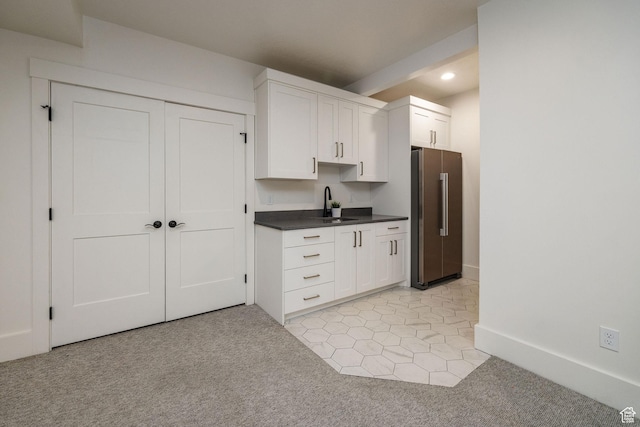 104 S 950 E, Hyde Park, UT 84318 - kitchen featuring freestanding refrigerator, light carpet, recessed lighting, white cabinets, and dark countertops