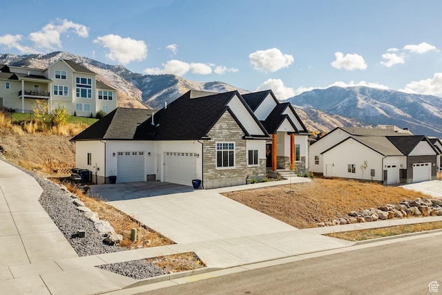 104 S 950 E, Hyde Park, UT 84318 - view of front of property with a mountain view, a garage, stone siding, concrete driveway, and a residential view